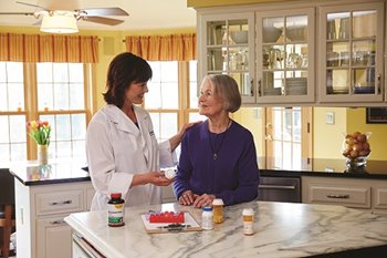 female-nurse-reviewing-medications-with-senior.jpg