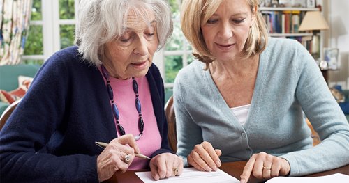 Woman discussing care options with aging mother