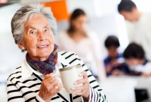 older woman holding mug of hot chocolate