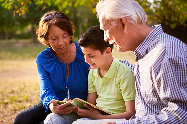 Grandson interviewing grandparents to learn about their life stories.