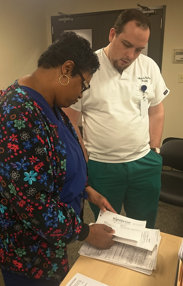 Ruth is mentoring Frank about scanning paperwork