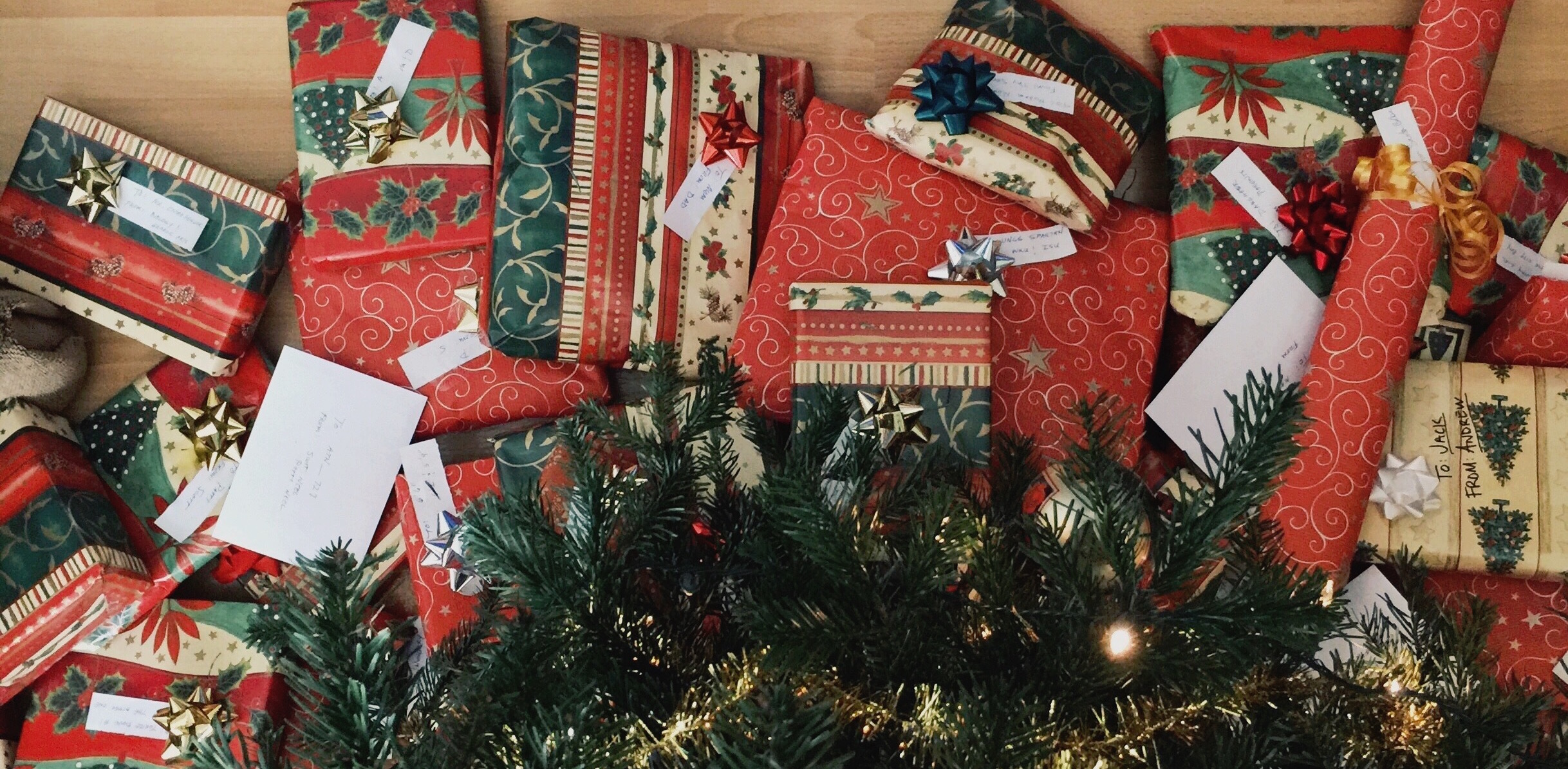 Photo of a pile of presents underneath a Christmas tree