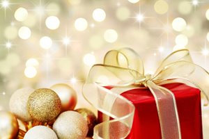 bigstock-Christmas-Gift-On-Defocused-Li-6064726.jpg