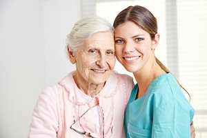 bigstock-Smiling-caregiver-embracing-ha-54611003.jpg