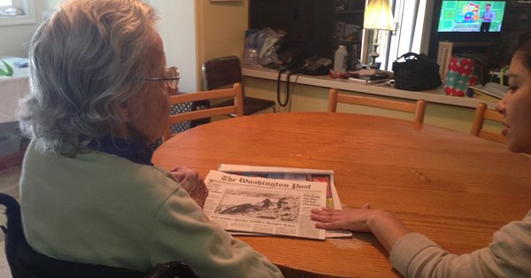 Jean and Veronica reading the daily newspaper