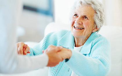 Caregiver Helps Elderly Patient with Alzheimer's