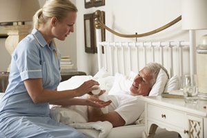 bigstock-Nurse-Giving-Senior-Male-Medic-92384702.jpg