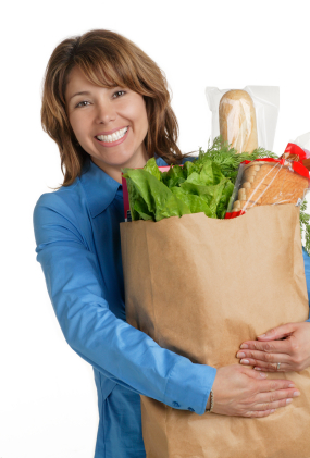 Woman holding bag of groceries for Holiday Healthy Eating