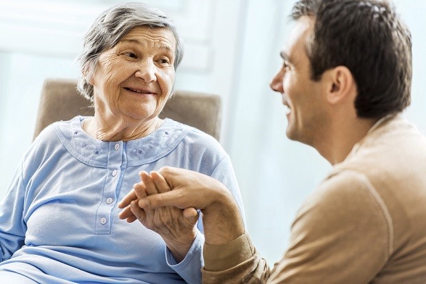 Senior woman communicating with her adult son. Focus is on senior woman. [url=http://www.istockphoto.com/search/lightbox/9786778][img]http://dl.dropbox.com/u/40117171/family.jpg[/img][/url]